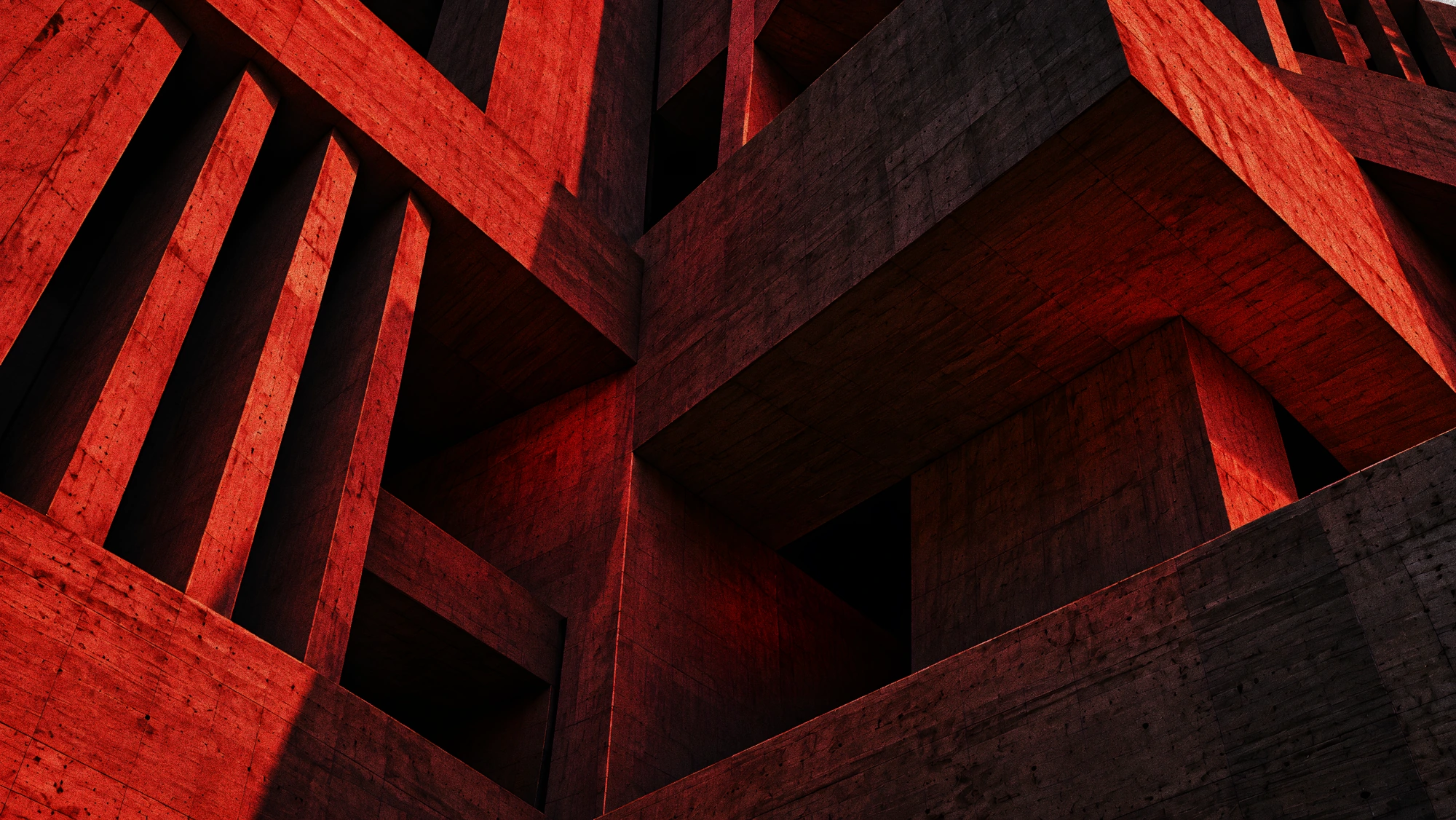 Architecture brutaliste en béton brut éclairée de rouge